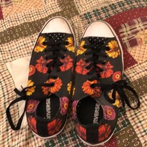 Levi jeans with a top and Converse shoes hoodie